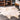 Iraida Faux Cowhide Area Rug: Off-White / Shaped / 4' x 5' nuLOOM