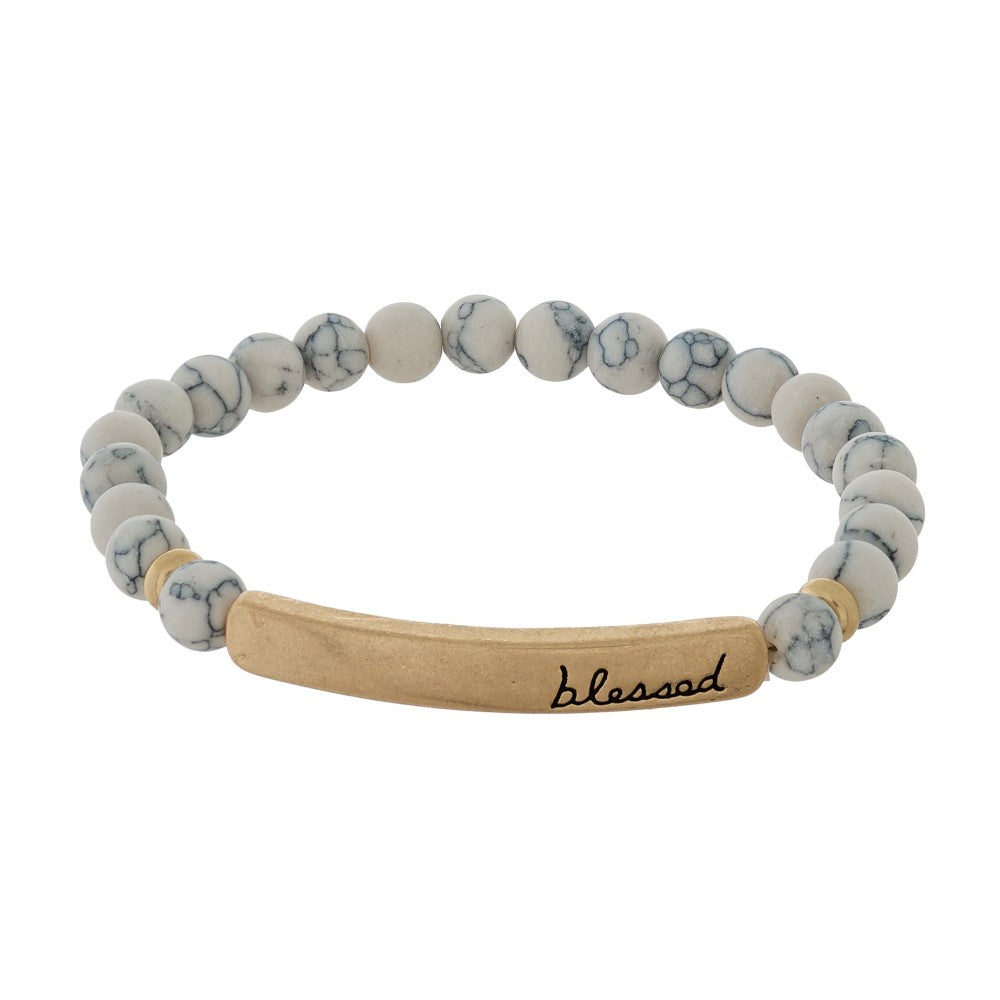 Beaded stretch bracelet with a bar focal, stamped with "blessed." Howlite Judson